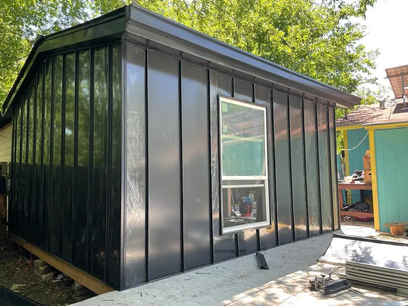 Black standing seam metal wall panels for Roof Inspection in Claiborne