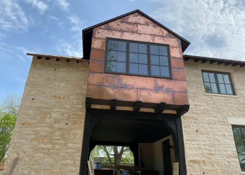 Copper metal panel facade on a stone building for Metal Roof Coating in Claiborne
