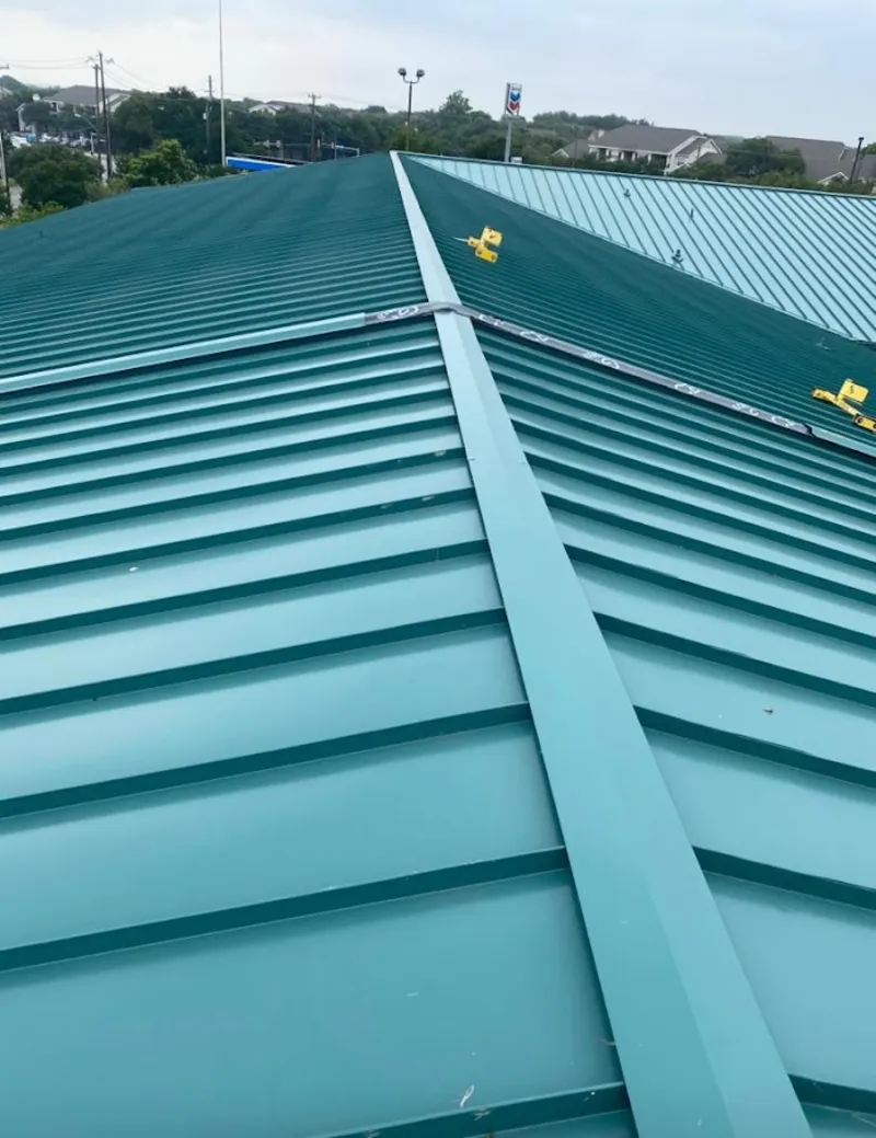 Green commercial metal roof ridge and valley for Metal Roof Repair in Claiborne